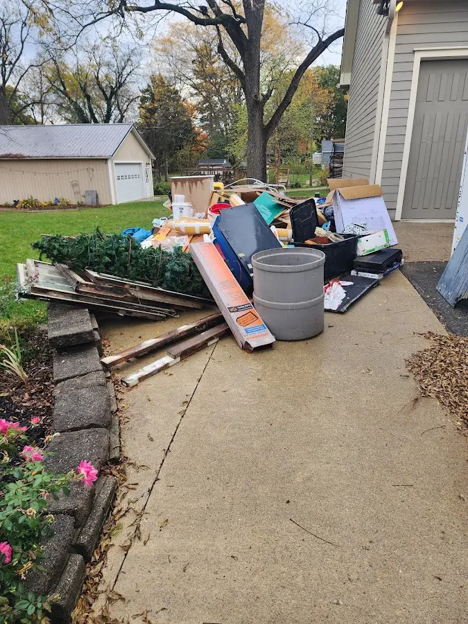 Dumpster being loaded with debris for Residential Dumpster Rental in Florence